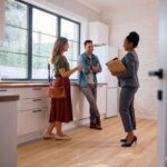 First time home buyer Virginia receiving house keys from a real estate agent